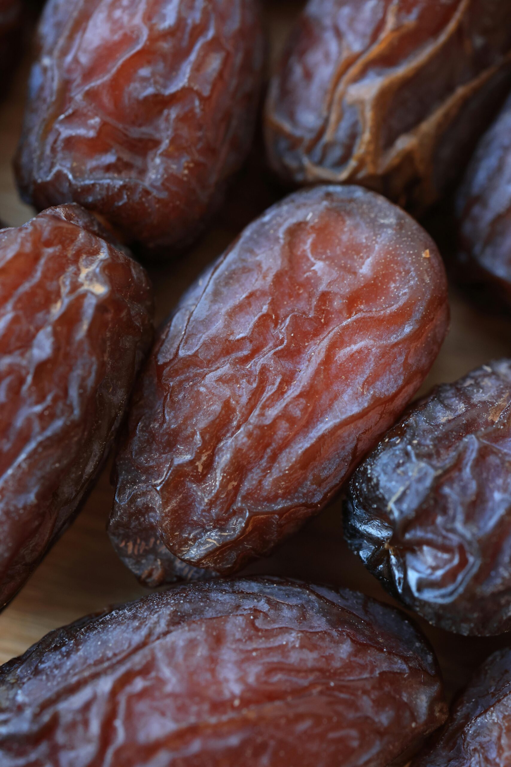 High-quality close-up of fresh organic dates showcasing texture and ripeness.